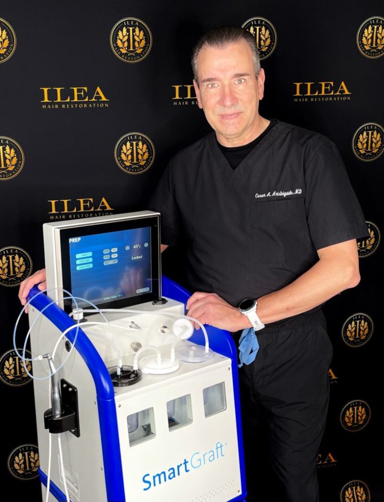 Dr. Cesar poses in black scrubs with advanced technology for the Why Choose Dr. Cesar section of the hair transplantation page.
