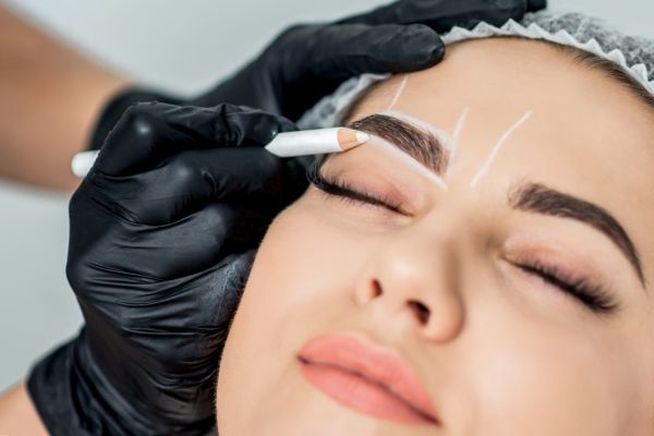A woman undergoing eyebrow transplant.