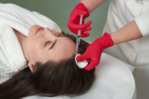 A woman lying while having Selphyl Plasma System.